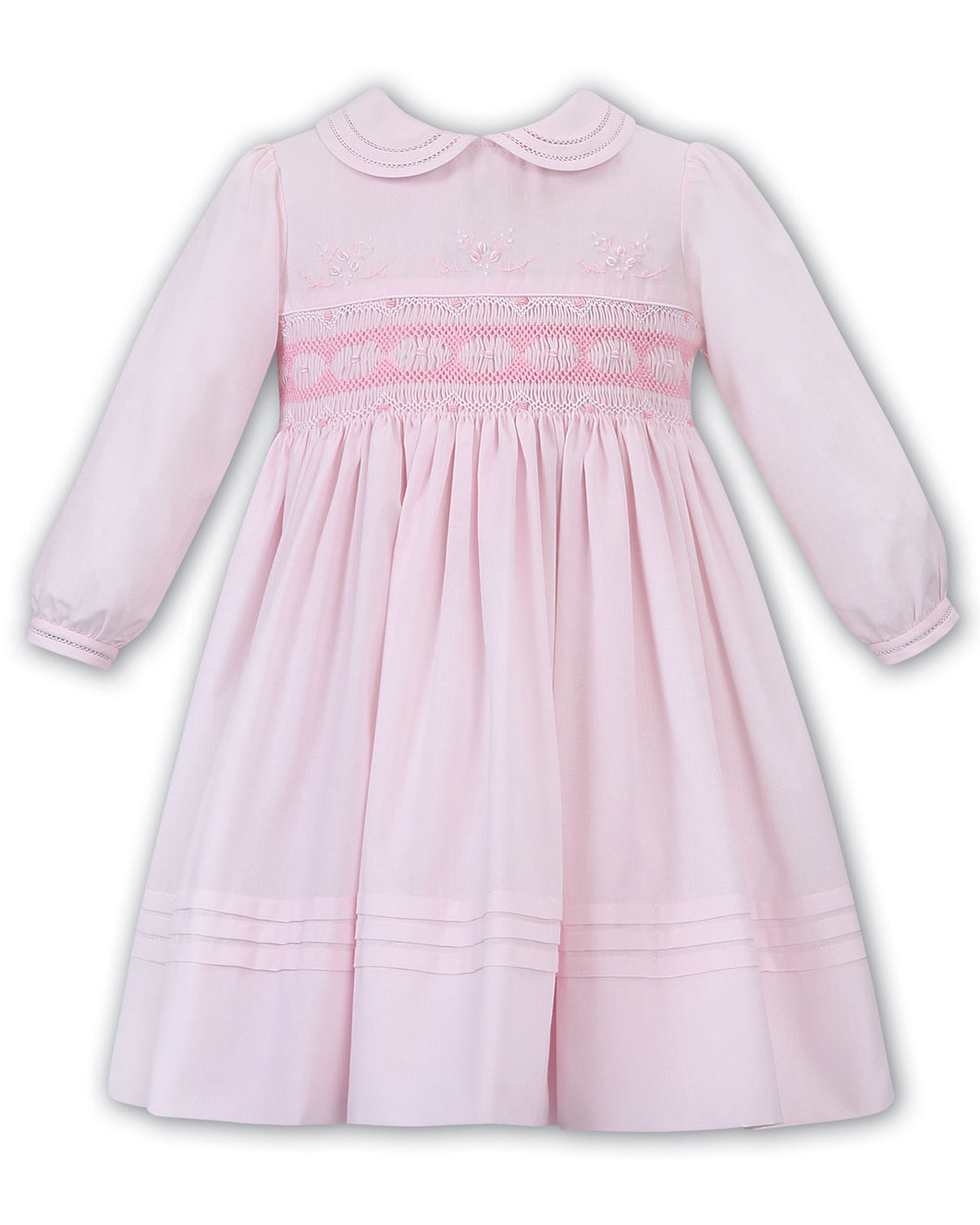 Girls Long Sleeved Traditional Hand Smocked Dress Embroidered Applique Detail to Bodice, Hemline and Sleeves. Peter Pan Collar