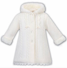 Girls Fully Lined Hooded Cable Knitted Coat.  Faux Fur on Hood and Sleeves. Belt Detail on Back. Front and Hemline Scallop Detail Trim