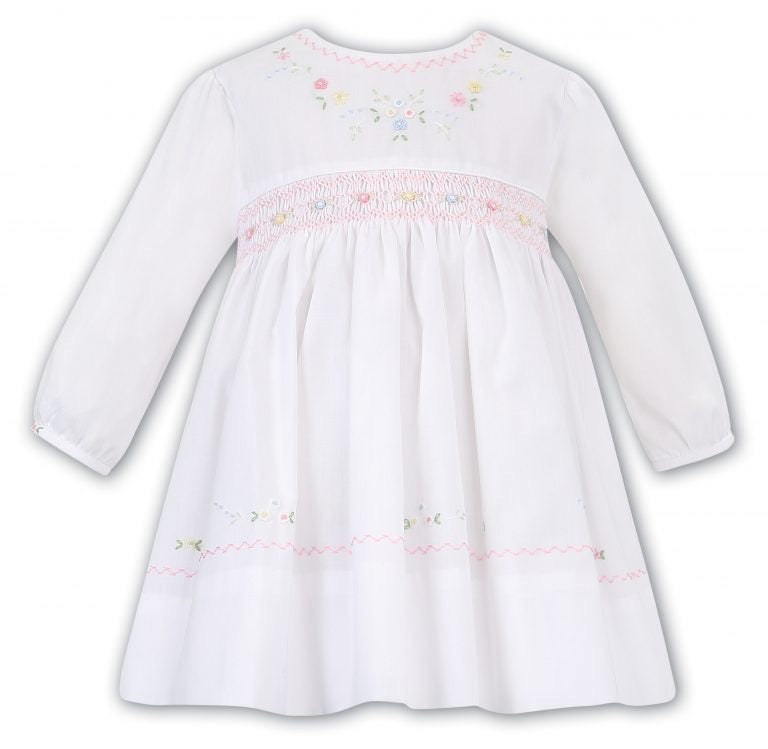Girls Long Sleeved Traditional Hand Smocked Dress with Embroidered and Applique Detail to Front, Hemline, Sleeves and Round Neckline