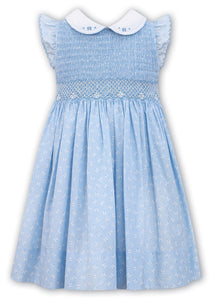 Traditional Hand Smocked and Embroidered Bodice in a Delicate Print Fabric, Contrasting Detailed Collar, Sleeveless.